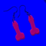 Pink willys light weight acrylic earrings with uv active glow